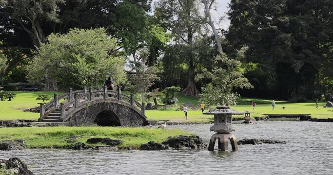 Hilo Hawaii Japanese Gardens Liliuokalani pond bridge. Liliʻuokalani Park and Gardens, Hilo. Largest Japanese garden part outside of Japan. Ponds, bridges, pagodas, statues and teahouse.
