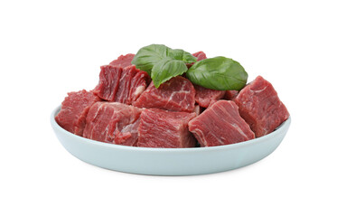 Fresh raw cut beef with basil leaves isolated on white