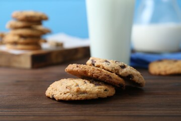 Delicious chocolate chip cookies on wooden table, closeup