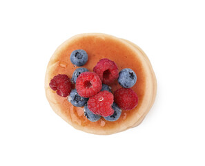 Delicious pancake with berries and honey isolated on white, top view