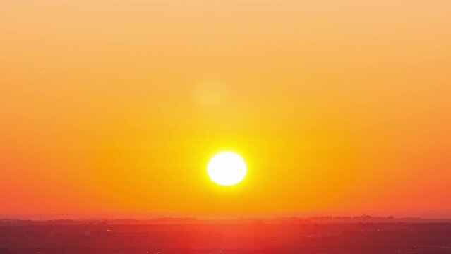 Orange sky Sunrise 4k timelapse footage. Clouds and Sun Rising Sky Time Lapse. wide-angle view Lens of sky n round sun Traveling in sky, Beginning of day season Concept. Location: Northern America.