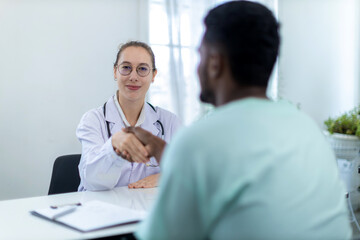 man and business woman shaking hands. Handshake between Black Man and Caucasian Woman. Cooperation and people concept