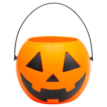 Halloween. Jack o lantern bucket for candy. Trick or treat on Halloween. Orange pumpkin scary smile face Jack-o-lantern. Happy Halloween. Hight resolution photo. White isolated background. 