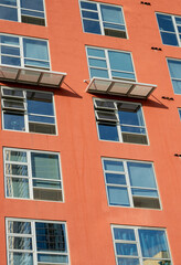 Red Building Wall with Silver Window Frames.