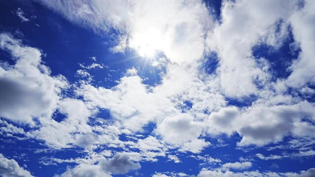 Cloudscape Timelapse - Various clouds flowing in sunny blue sky
