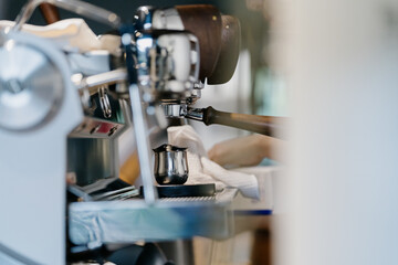 Barista is making coffee in cafe