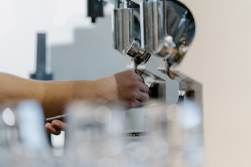 Barista making coffee in cafe
