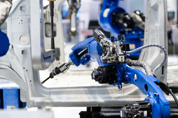 Fototapeta premium robot arm working in car factory