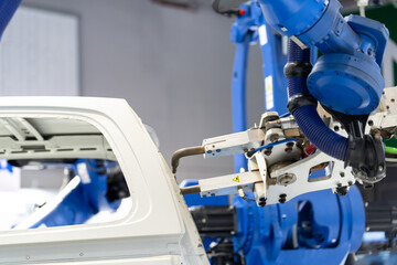 robot arm working in car factory