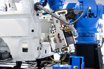 robot arm working in car factory