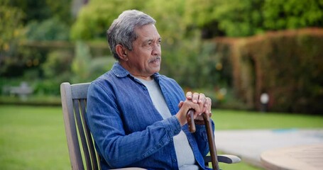 Thinking, backyard and senior man with cane and relax on retirement in a garden lawn for peace or calm. Memory, outdoor and serious elderly person remember reflection, thought and wonder on weekend