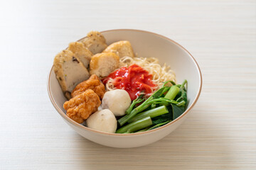 egg noodles with fish balls and shrimp balls in pink sauce, Yen Ta Four or Yen Ta Fo