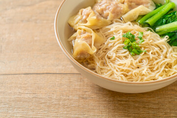 egg noodles with pork wonton soup or pork dumplings soup and vegetable