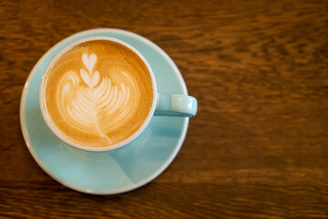 hot latte coffee cup on table