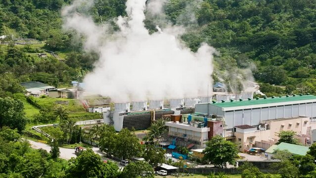 Geothermal power production plant. Geothermal station with steam and pipes. Negros, Philippines.