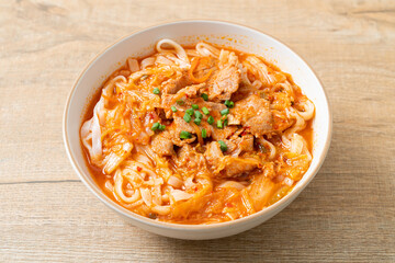Korean udon ramen noodles with pork in kimchi soup