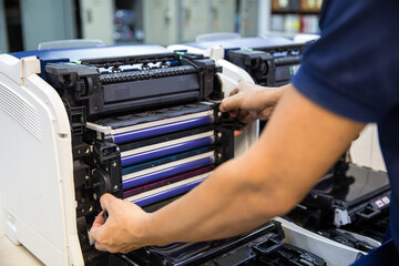Technician hand open cover photocopier or photocopy to fix repair copier problem paper jam and...