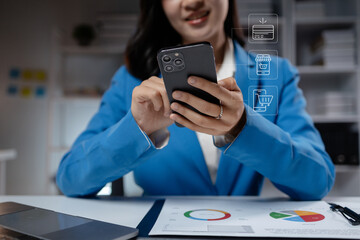 Business woman dials mobile phone, Asian female employee uses smartphone, looks at information and does online shopping. Concept of using smartphones.