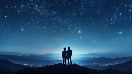 Fotobehang Dark silhouette of young couple hiker were standing at the top of the mountain looking at the stars at twilight sky. © BOMB8