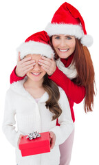 Digital png photo of caucasian mother and daughter in santa hats with gift on transparent background