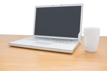 Digital png illustration of laptop and mug on wooden desk on transparent background