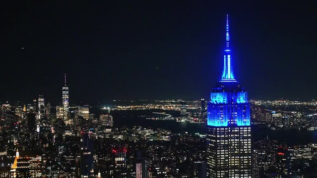 Aerial view of  empire state building and hudson river in manhattan, new york at night