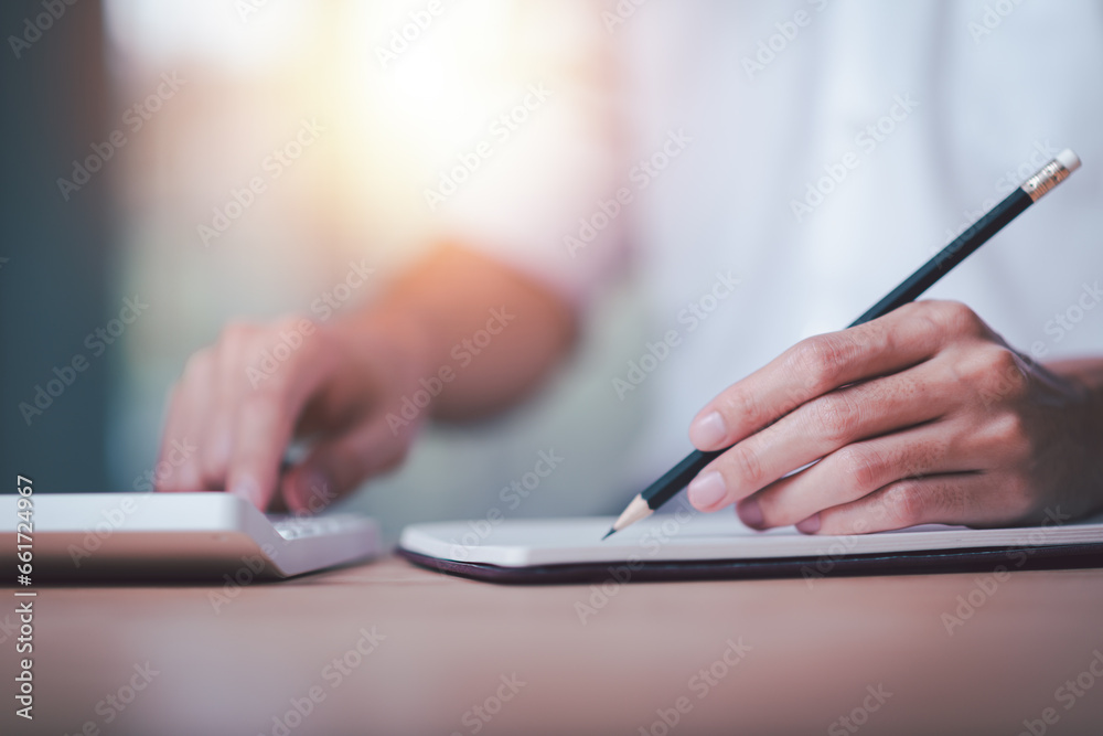 Poster Businessman using a calculator to calculate numbers ,profit and loss statement review of company performance ,cost analysis ,financial paperwork ,Calculation of tax information reports