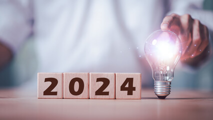 Merry Christmas and Happy New Year 2024 concept, Planning to start a new business and life ,business appraisal ,businessman new year business goals 2024 ,marketing strategy planning ,focused