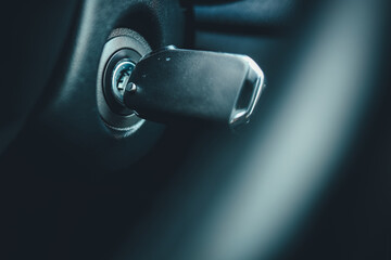 Ignition key of modern car close up. Car key in keyhole