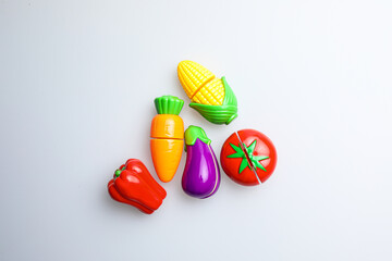 Fresh fruit, vegetables, delicious food, Sushi, 
Hamburger and pizza. Colorful educational toys from cute kids.