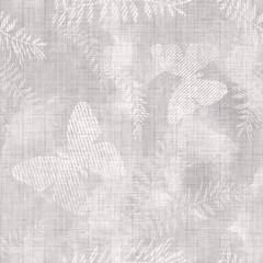 Seamless textured monochrome light gray, beige tropical pattern with palm leaves and butterflies. Canvas texture.