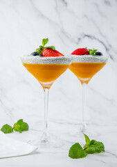 exotic fruit cocktails with berries and chia seed topping and mint side view