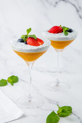 exotic fruit cocktails with berries and chia seed topping and mint side view
