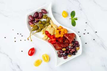 assorted nuts and dried vegetables on a light background top view