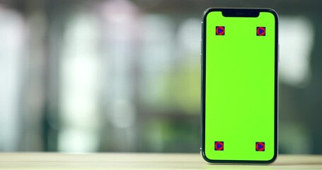 Phone, table and green screen on mockup for advertising or marketing flip with tracking markers. Closeup of mobile smartphone display or app for technology advertisement, showcase and tips on desk