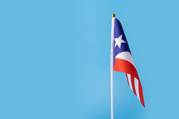 puerto rican flag on a blue background, copy space, independence national day of puerto rico,...