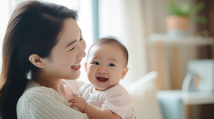 Happy smile mother takes care and hold her cute baby, selective focus