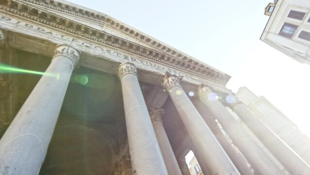 Sun beams on beautiful pantheon in Rome, Italy - low, pan shot
