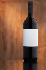 bottle of wine with white label on light dreamy background