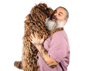 Happy European man hugs cute water dog, posing with pet on transoarent background