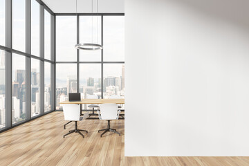 Fototapeta premium Cozy conference room interior with table and chairs, window. Mock up wall