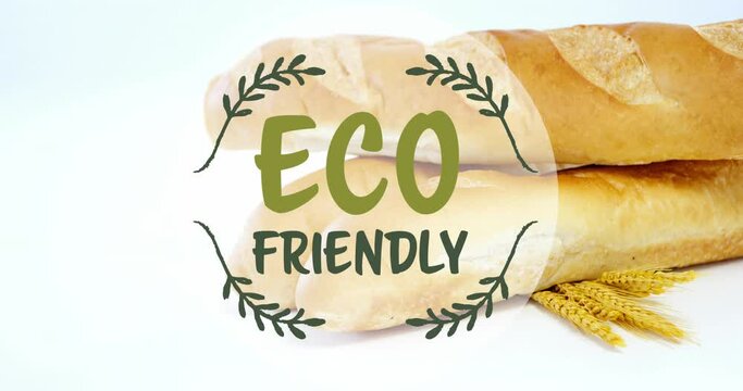 Animation of eco friendly text banner against close up of fresh bread and wheat ears
