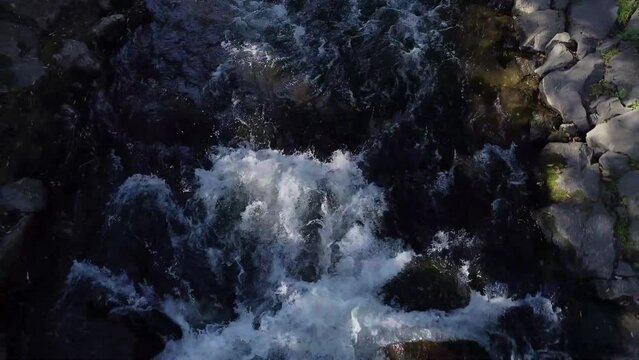River with stones and trees byside