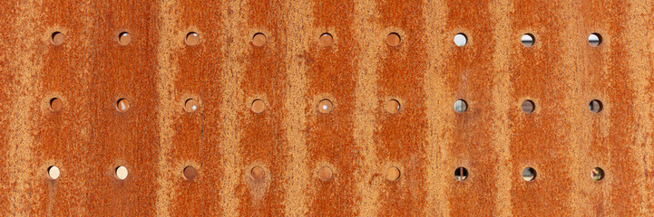 Rusty metal hole mesh pattern. Panoramic image