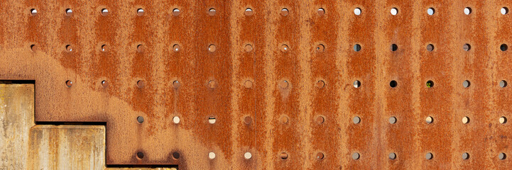 Rusty metal hole mesh pattern. Panoramic image