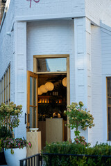 Restaurant with withe facade in downtown new york city streets