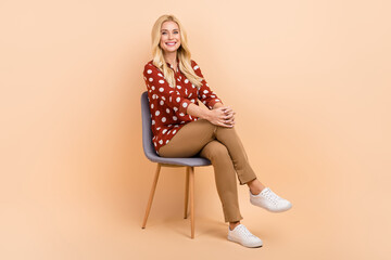Full size photo of pretty positive lady sit chair job vacancy interview crossed legs isolated on...