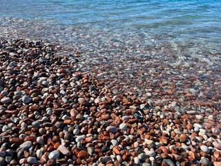Sea waves and pebble beach.