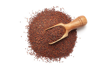 A pile of Organic Ragi (Eleusine coracana) or finger millet with a wooden scoop, isolated on a...