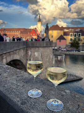 View of the town of W&uuml;rzburg while drinking Franconian wine on Alte Mainbruecke - the Old Main Bridge in Germany